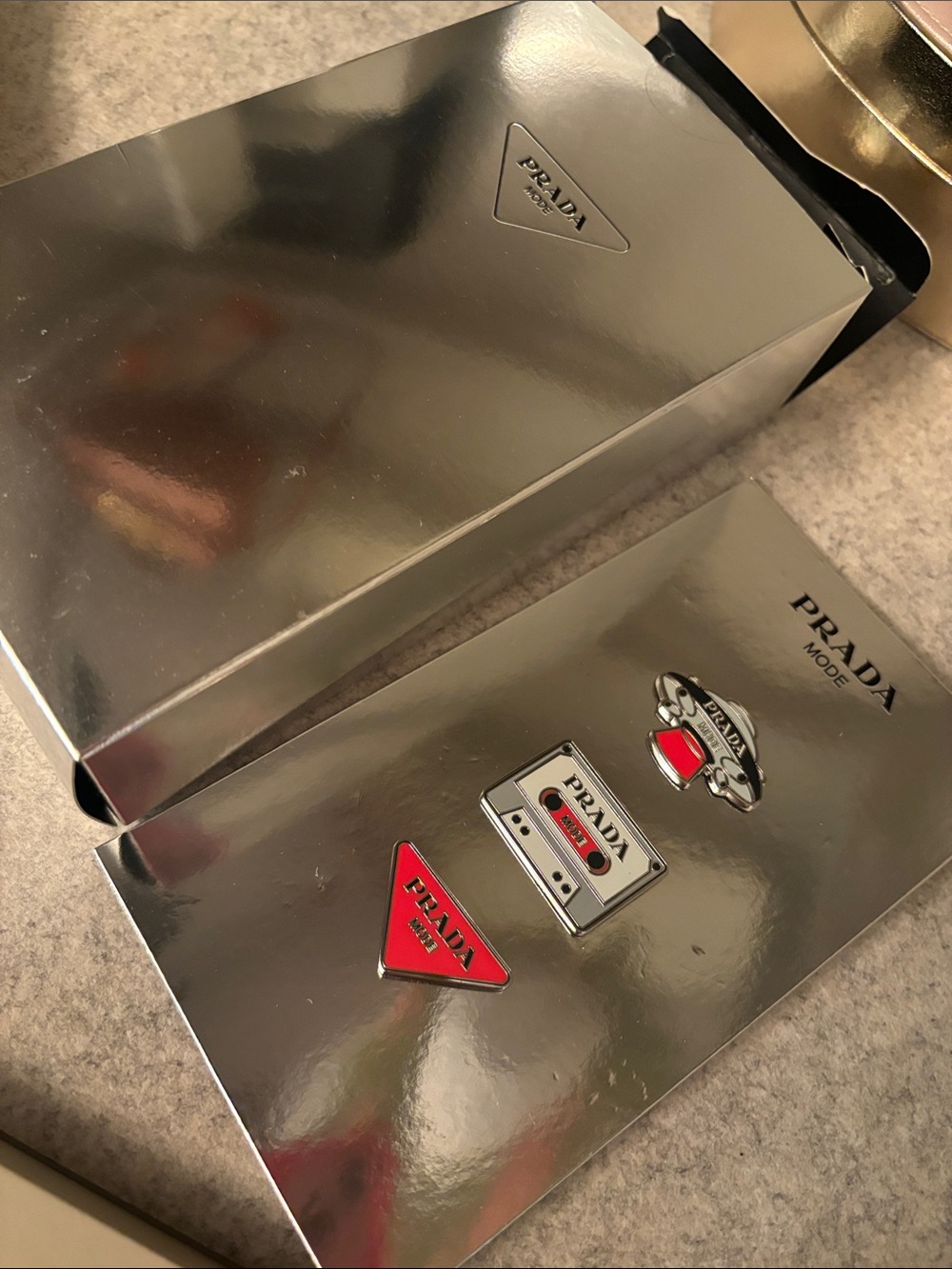Prada Silver Metallic Presentation Box with Red Logo Pins